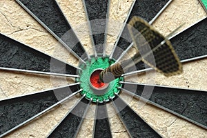 Darts arrow in the target photo