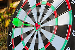 Darts arrow in the target center of the heart