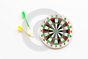 Darts game - simple sport for lesure time. Dartboard and arrows or dart on white background top view