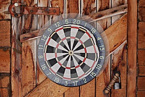 Darts on old wooden wall