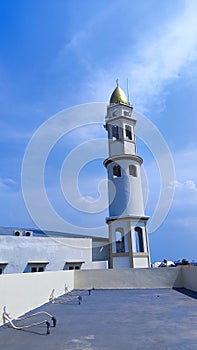 Darul Hijrah mosque tower from the top of the new classroom of the Stai Ali bin Abi Talib campus, Surabaya City, East Java photo
