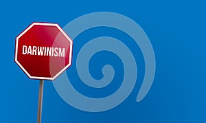 Darwinism - red sign with blue sky