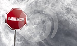 Darwinism - red sign with clouds in background