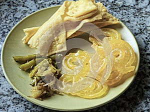 For Dasara Kesari Jalebi Fafda a savory items and Papaya Chutney photo