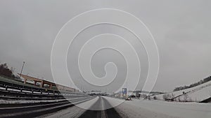 Dash camera in car, snow on highway