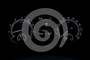 The dashboard of the car is glowing blue with white arrows at night with a speedometer, tachometer and other tools to monitor the