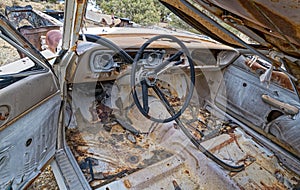The dashboard and interior of a wrecked automobile