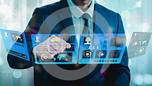 data analysis. On a futuristic virtual interface screen, a man programmer studies and creates software using a digital tablet