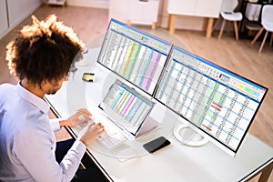 Data Analyst African Man Using Spreadsheet