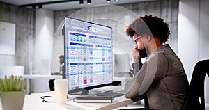 Data Analyst African Man Using Spreadsheet