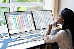 Data Analyst African Woman Using Spreadsheet