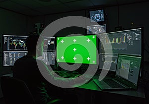 Data Analyst at Work in a Dark Control Room