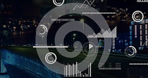 Data analytics and graphs image over city traffic at night