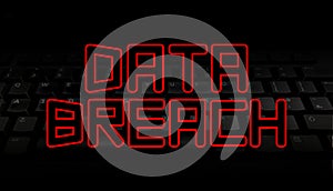 Data Breach red text over black keyboard illustration