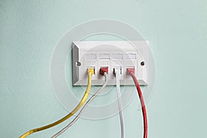 Data CAT6 Double Socket Quad Port Faceplate with four network cables plugged in