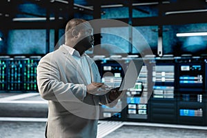 Data center admin running system diagnostic tests and error checking utilities