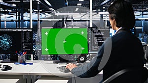 Data center admin typing on isolated screen PC keyboard, using AI