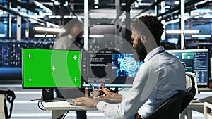 Data center admin using AI node tree software on isolated screen PC