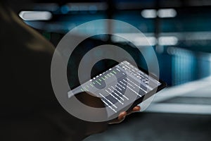 Data center computer scientist using tablet to optimize network infrastructure