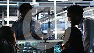 Data center coworkers doing brainstorming, using node tree software