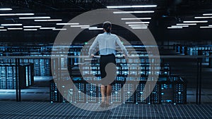 Data Center Engineer Looking Down from a Balcony on Server Farm Cloud Computing Specialist Facility