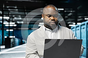 Data center engineer running error checking utilities on laptop