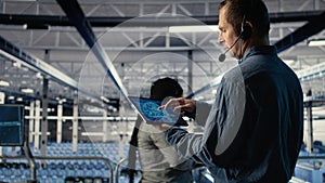 Data center engineer using AI on tablet to help clients resolve hosting problems