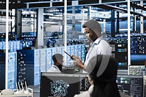 Data center engineer using AI visualization tools to identify malfunctions