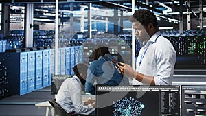 Data center engineer using tablet to interpret AI generated data analytics graphs