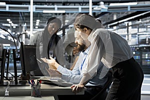 Data center engineering team doing brainstorming, monitoring system performance