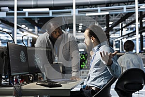 Data center manager berating employee, reproaching performance issues