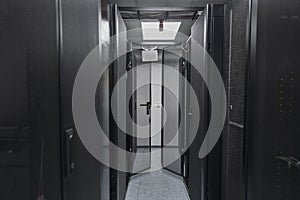 Data Center With Multiple Rows of Fully Operational Server Racks. Modern Telecommunications, Cloud Computing, Artificial