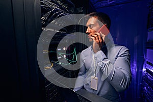 Data center IT professional monitoring network server performance