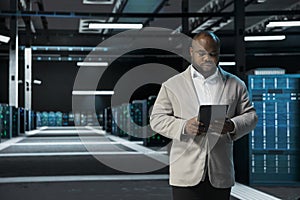 Data center programmer running error checking utilities on tablet