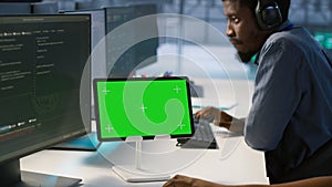 Data center programmer using mockup tablet, maintaining company network