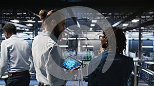 Data center system administrators performing maintenance on AI supercomputers