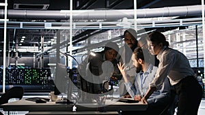 Data center system administrators performing maintenance on supercomputers