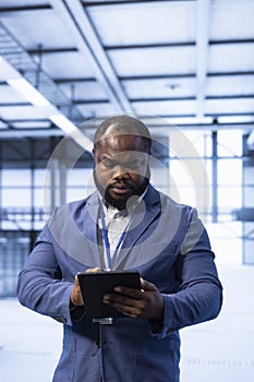 Data center technician ensuring safety and security of database using tablet