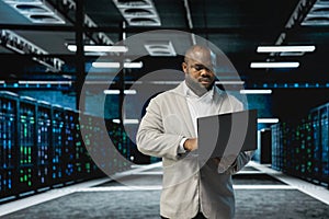 Data center technician running error checking utilities on notebook