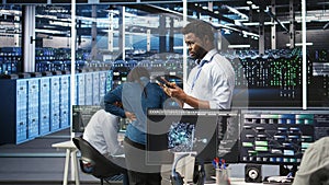 Data center technician using tablet to do node tree programming