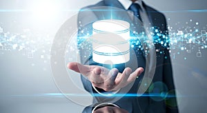 Businessman Holding Data Database Icon. Cloud Computing Global Network Technology Hand Blue Digital Background
