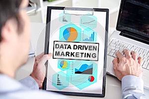 Data driven marketing concept on a clipboard