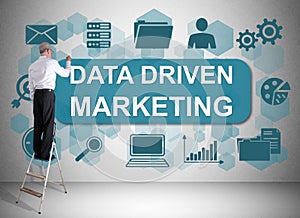Data driven marketing concept drawn by a man on a ladder