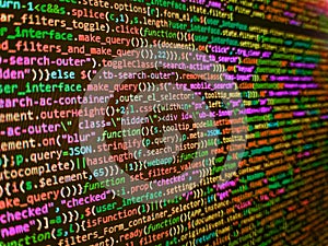 Data encryption security code on a computer display, close up. Program development concept. Software developer programming code.