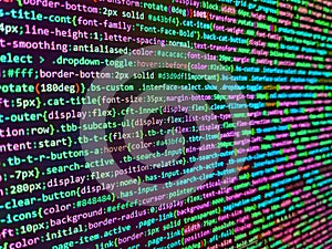 Data encryption security code on a computer display. Closeup of Java Script and HTML code. Screenshot with random parts of program