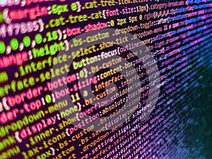 Data encryption security code on a computer display. Programmer working on computer screen. Code of javascript language on white