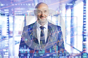 Data graph over smiling businessman at the office