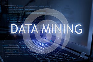 Data mining inscription against laptop and code background