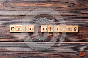 Data mining word written on wood block. Data mining text on cement table for your desing, concept