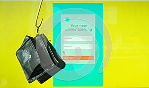 data phishing, big hook and wallet on computer display showing fictional online banking phishing website,cyber crime,computer